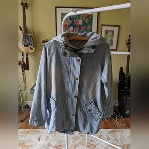 Jean jacket with grey sweater vest inside